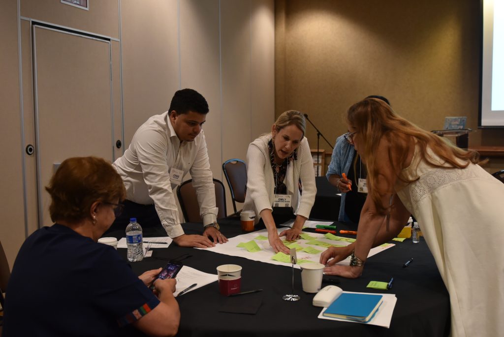 Conference participants engage in a small group activity.
